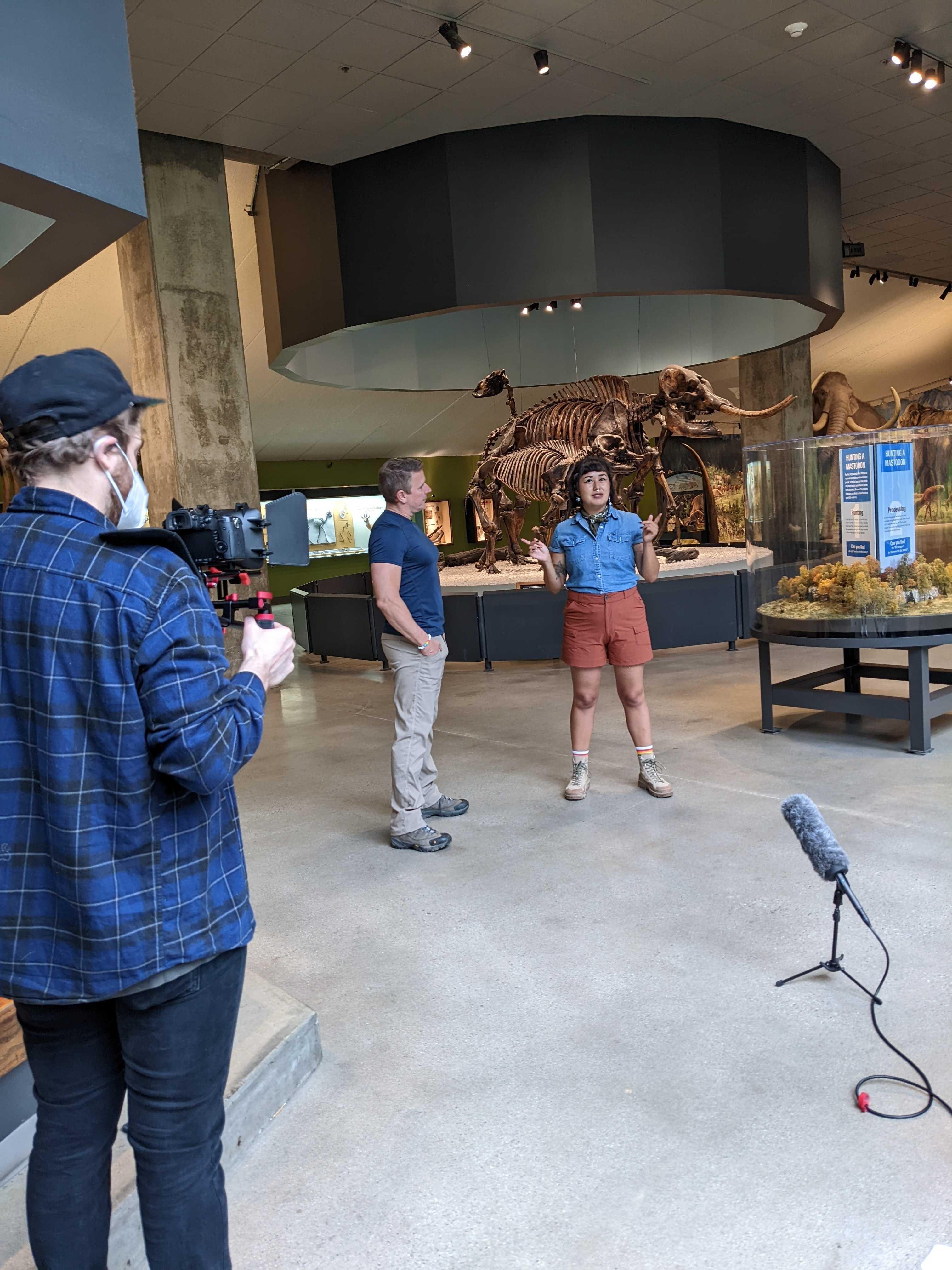 Behind the scenes of Michelle Barboza-Ramirez and Blake de Pastino shooting a scene on-location at the La Brea Tar Pits.