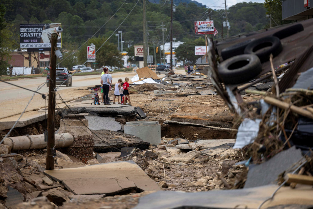 Swannanoa residents walk through devastating flood damage from the Swannanoa River