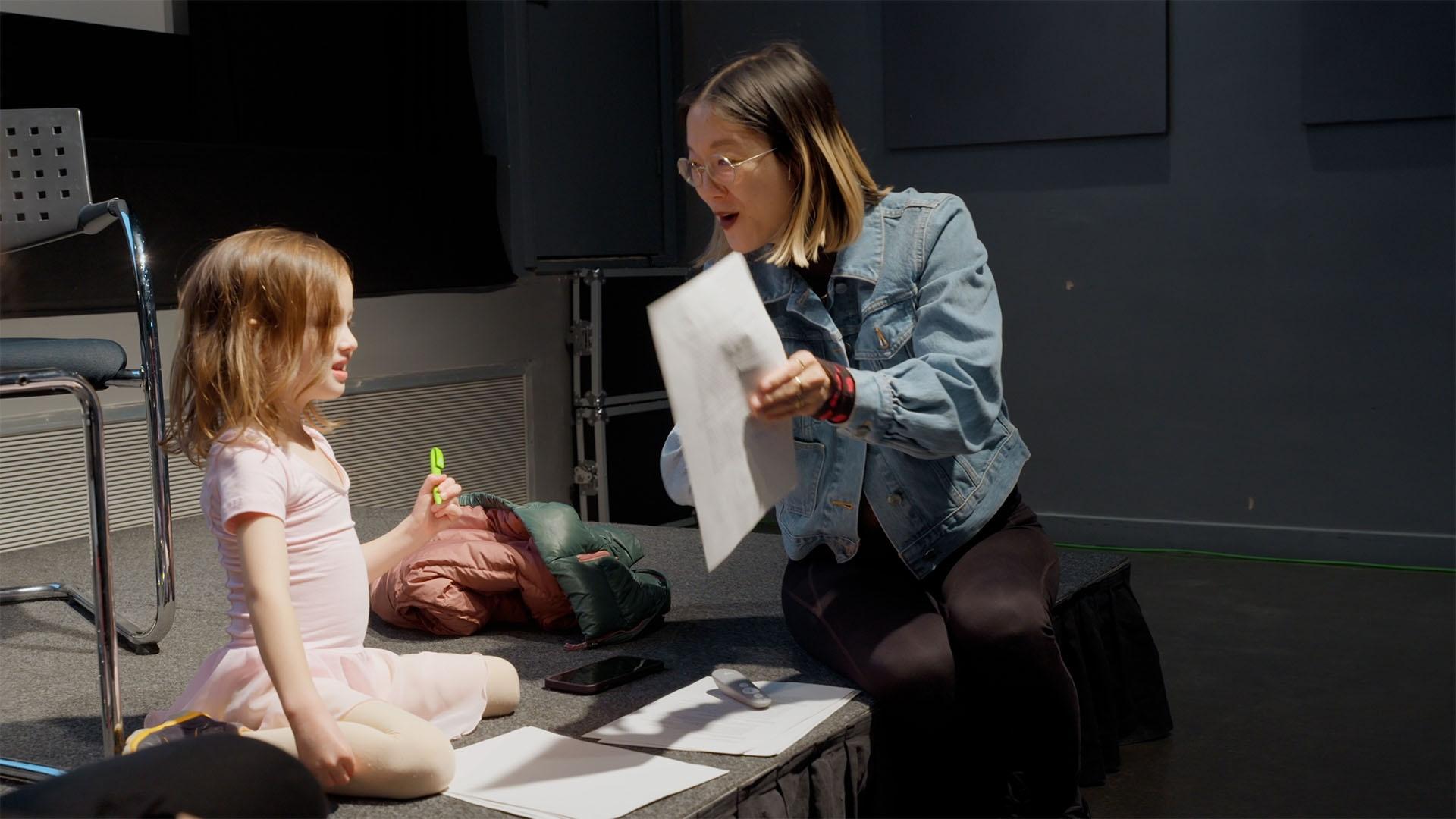 Christine Sun Kim with her daughter Roux at Somerset House in London, United Kingdom.