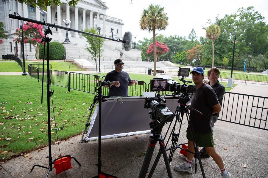 Host KJ Kearney and crew getting ready to record stand-ups in front of the South Carolina State House.