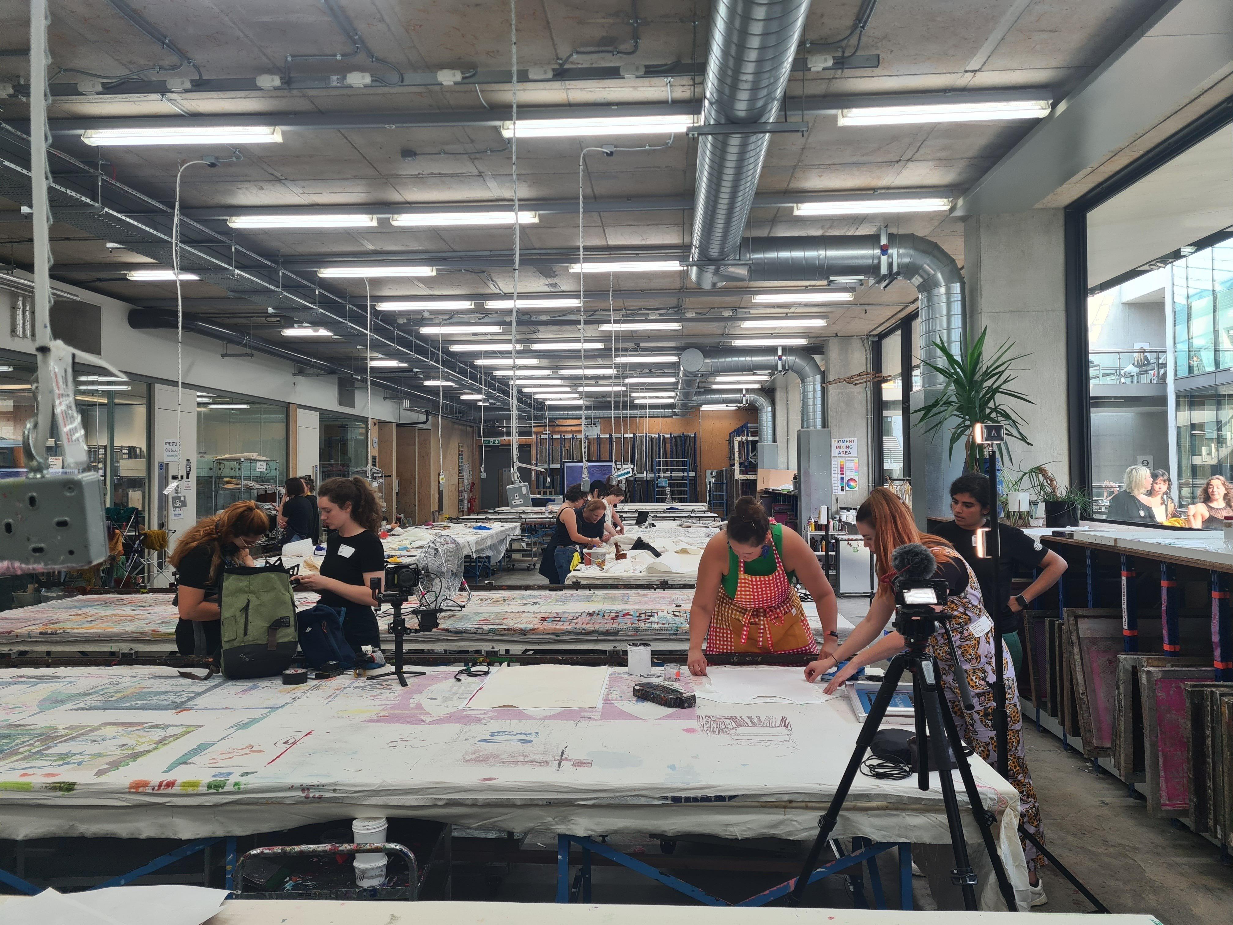 Screen printing a t-shirt with bacterially-produced dye for episode 1 in the Central Saint Martins Print Lab.