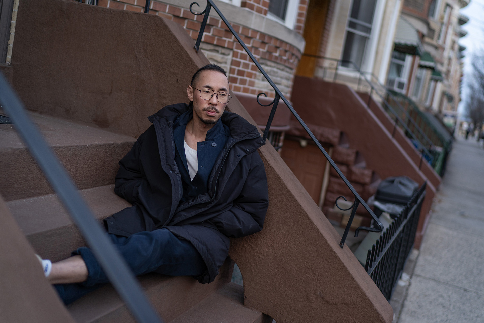 Robert Calabretta sits on the steps outside his apartment in New York.